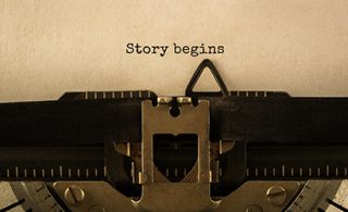 \'Story begins\' typed on a typewriter